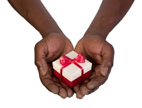 Man holding a gift box in hands isolated on white Stock Photos