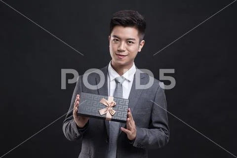 Man Holding A Gift Box