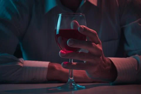 A man holding a glass of wine Foto stock