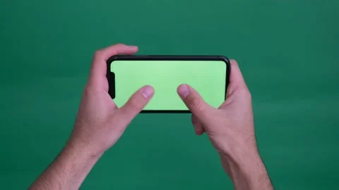 Man holding green screen phone zoom in Video stock 236373445