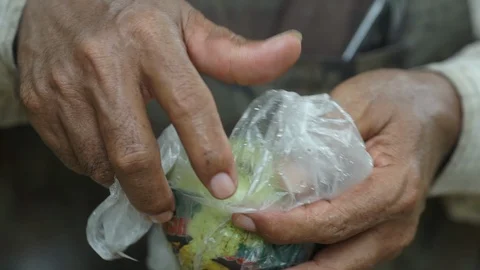 Man holding a guava in hand Stock Footage 126073700