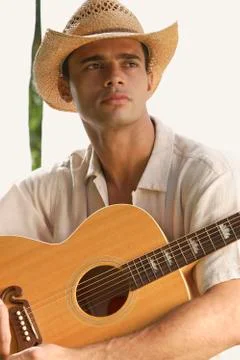 Man holding guitar Stock Photos
