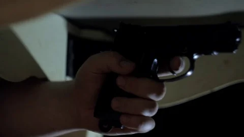 Man holding a gun close-up Stock Footage 71575544