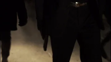 Man holding gun while walking with a group down a dark alley Stock Footage 85488060