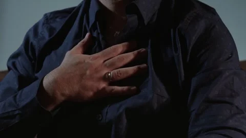 Man holding hand on chest feeling pain connected to heart attack and urgent Stock Footage 324960405