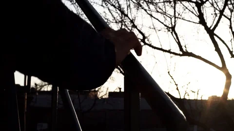 Man holding hand railing rises up Stock Footage 127361804