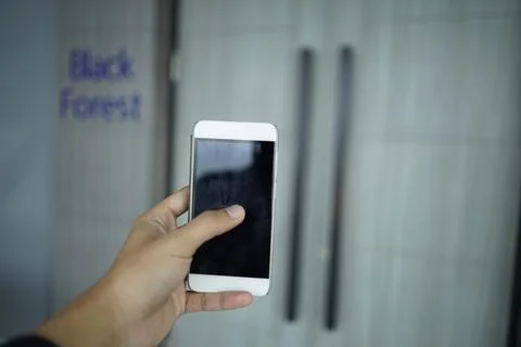 Man holding the handphone Stock Photos