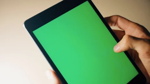 Man holding in hands tablet pc with chroma key screen. Man using tablet with Stock Footage 120300062