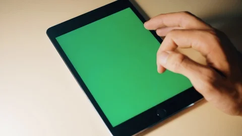 Man holding in hands tablet pc with chroma key screen. Man using tablet with Stock Footage 120300075