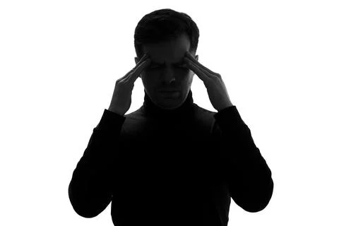Man holding hands on temples having a headache or trying to make a decision Stock Photos