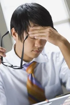 Man holding head Stock Photos