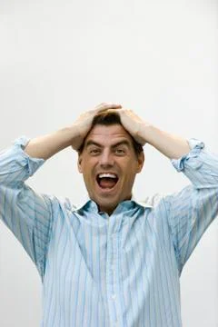 Man holding head screaming Stock Photos