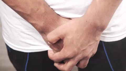 Man holding his crotch because of pain or urgency close up shot of hands co.. Stock Footage 332475382