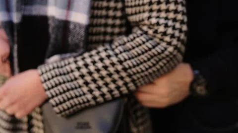 A man holding his girlfriend hands and hugging her on the street Stock Footage 61825654
