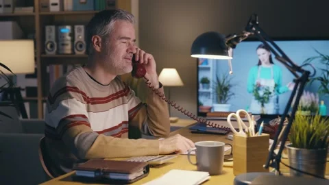 Man holding an invoice and calling the customer service Stock Footage 306126514