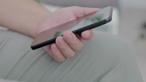 Man holding iPhone with chat application WhatsApp on the screen Stock Footage 307607865