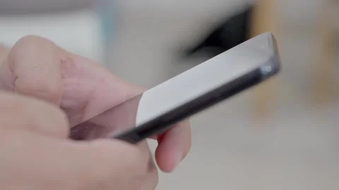 Man holding iPhone with chat application WhatsApp on the screen Stock Footage 307607869