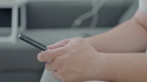 Man holding iPhone with chat application WhatsApp on the screen Stock Footage 307607870
