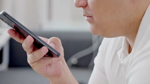 Man holding iPhone with chat application WhatsApp on the screen Stock Footage 307607877