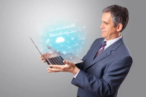 Man holding laptop with cloud based system concept Foto stock