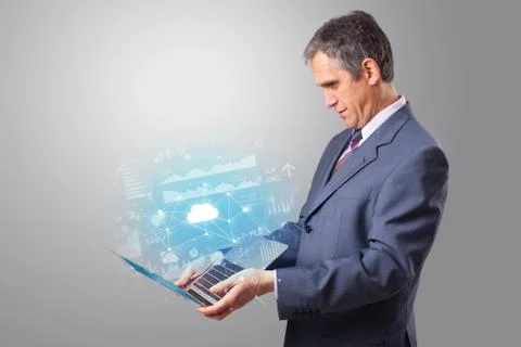 Man holding laptop with cloud based system concept Foto stock