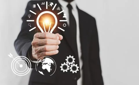Man is holding light bulb Creative new idea, Innovation, brainstorming, inspi Stock Photos