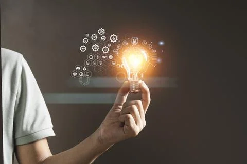 Man holding light bulbs. future innovative technology and creativity concept. Stock Photos