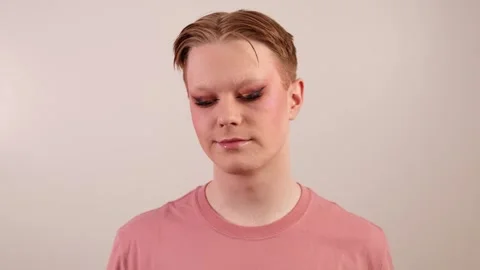 Man Holding Makeup Brush Posing with Finished Look Stock Footage 310142020