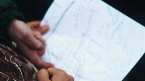 Man Holding a Map in His Hands Stock Footage 60996070