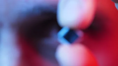 Man holding microprocessor in a hand Stockbeeldmateriaal 130771005