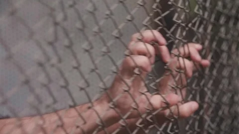 The man is holding onto the net Stock Footage 273768722