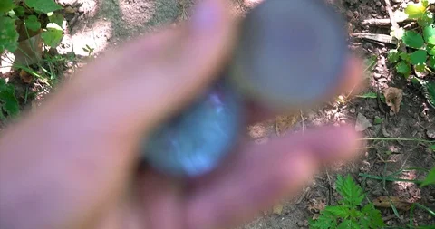 Man holding an old compass in hand and rotate around the axis. Video stock 127747359