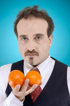 Man holding oranges Stock Photos