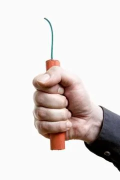 A man holding out a stick of dynamite, close-up of hand Stock Photos