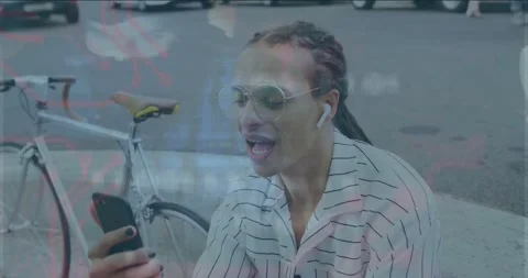 Man holding phone and waving, initiating live call by bike, tech overlaying Stock Footage 334036655