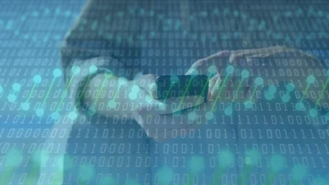 Man holding phone flat and tapping screen, showing binary overlay over hands Stock Footage 333790435