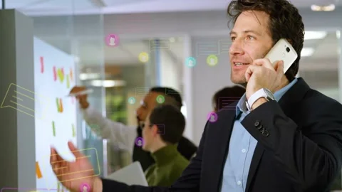 Man holding phone gesturing at board while team moving notes, animated icons Stock Footage 335740000