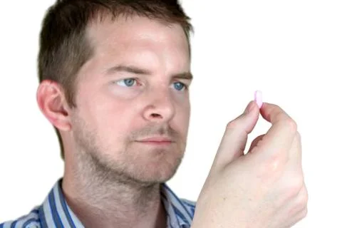 Man holding a pill Stock Photos