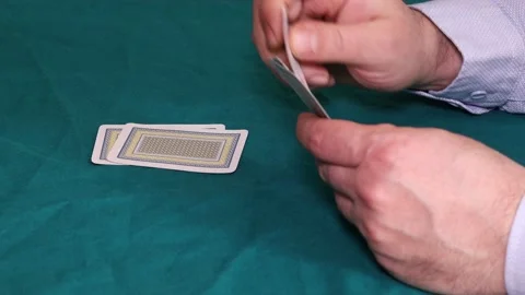 A man holding playing card Stock Footage 172414743