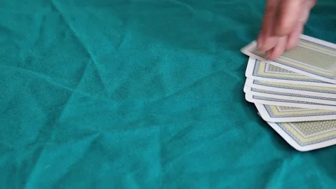 A man holding playing card Stock Footage 172415810