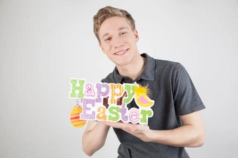 Man holding a poster celebrating easter Stock Photos