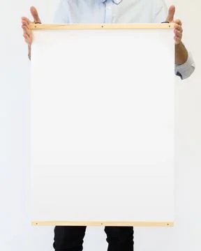 Man holding poster frame mockup Stock Photos