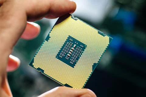 Man holding powerful CPU processor for computer 写真素材