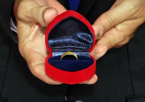 Man holding proposal ring Stock Photos