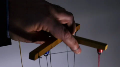 Man holding puppet string Stock Footage 54639597