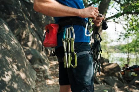 Man holding a quick draw getting ready to climb outdoors in Stockholm Stock Photos