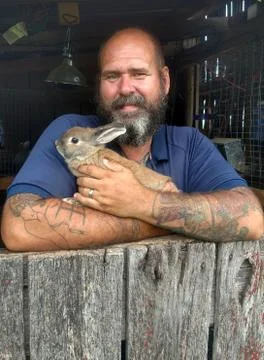 Man holding rabbit Stock Photos