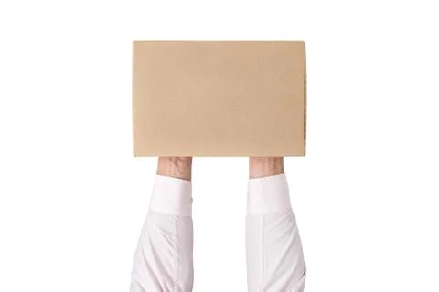 Man holding a rectangular cardboard box on white background. Top view Stock Photos