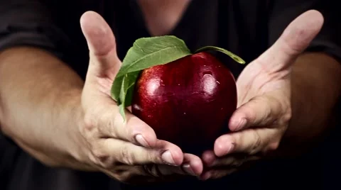 Man holding a red apple in her hands Stock Footage 40693121