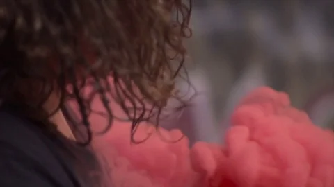 Man Holding Red Smoke Grenade Stock Footage 81486778